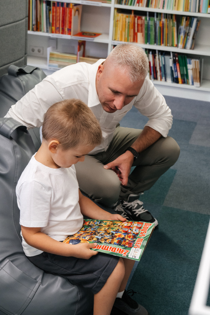 Saulius and Lukas reading together